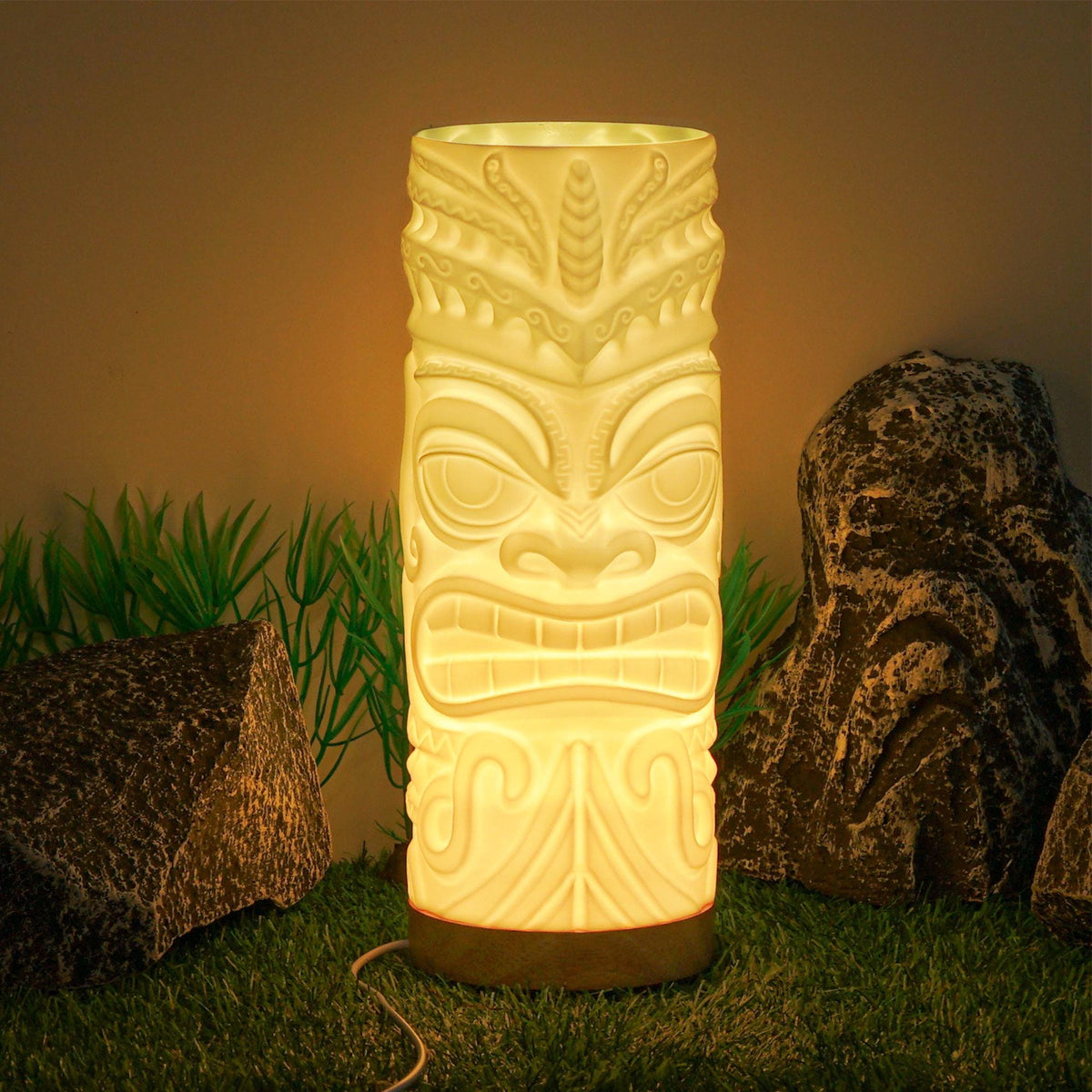 Stern tiki lamp glowing warm on a tropical scene