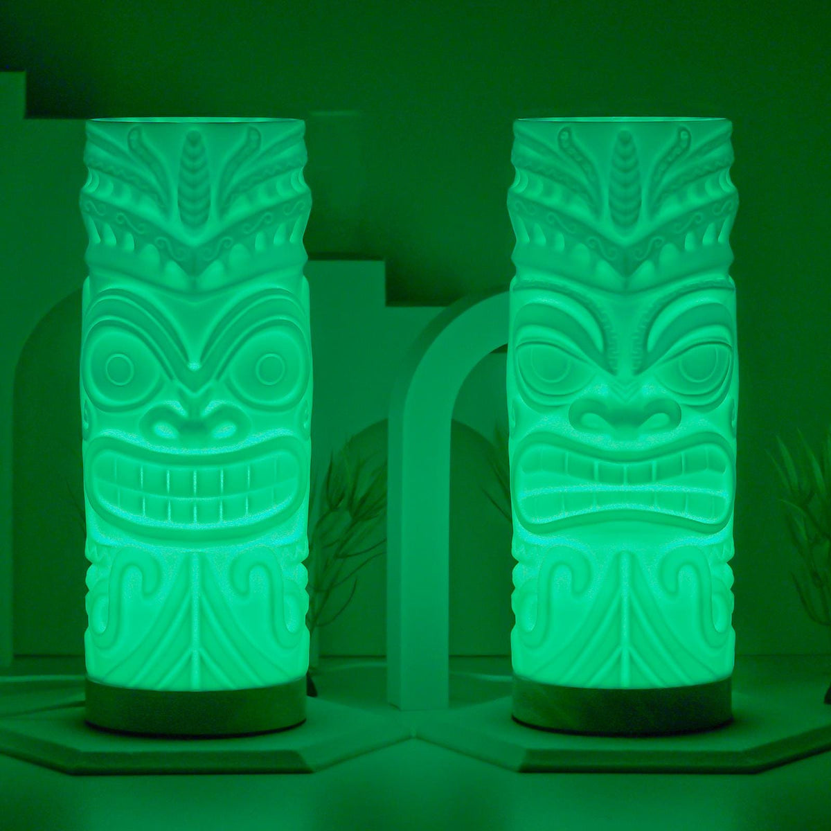 Pair of tiki lamps glowing green